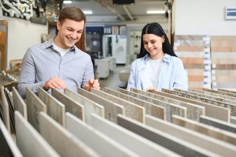 Beautiful Young Couple Choosing Ceramic Tiles