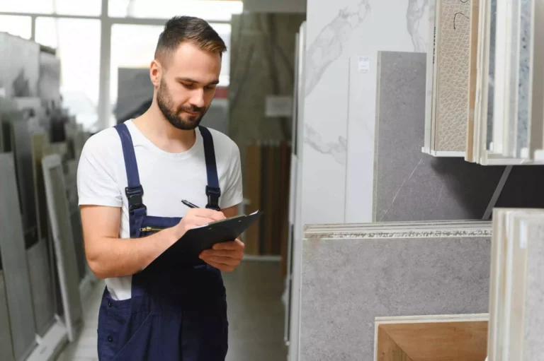 Plumber In Uniform At Showcase In Plumbering Store